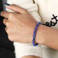 Stylish Lapis Lazuli Stretch Bracelet featuring 6mm beads, a symbol of inspiration, confidence, and creativity, elegantly adorning the wrist