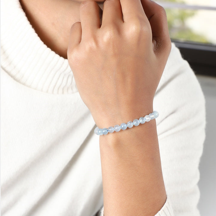 Versatile styling suggestions for the Aquamarine Bracelet, a fashionable accessory exuding inspiration, courage, and clarity