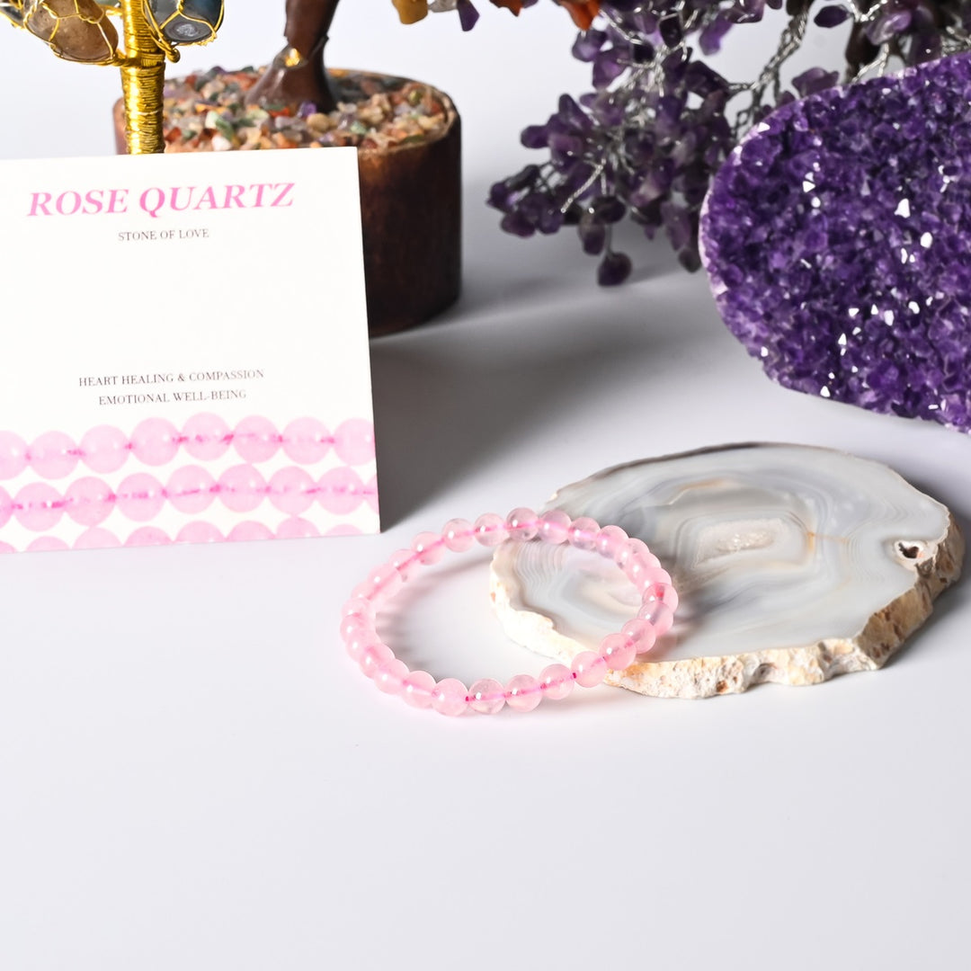 Stylish Rose Quartz Stretch Bracelet adorned with 6mm smooth round beads, radiating the gentle and loving energy of the Stone of Love