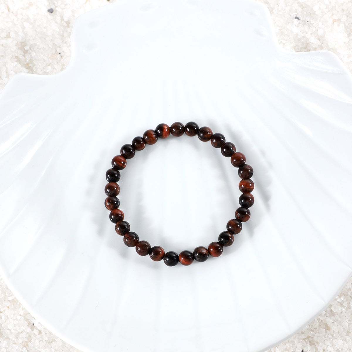 Symbolic image representing the empowering connection with the transformative energies of courage and strength associated with the Red Tiger's Eye Bracelet