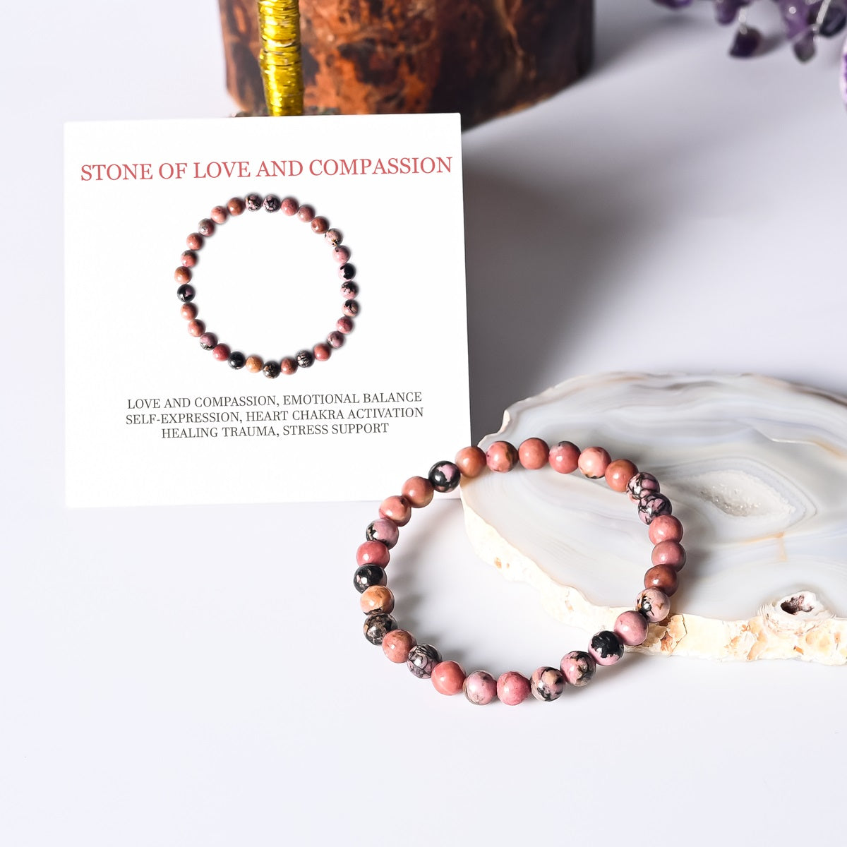 Artistic representation symbolizing love and compassion, featuring the Rhodonite Stretch Bracelet as a source of emotional healing and understanding