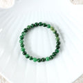 Visual representation of harmony and prosperity associated with the Jade Stretch Bracelet, radiating positive energy and abundance