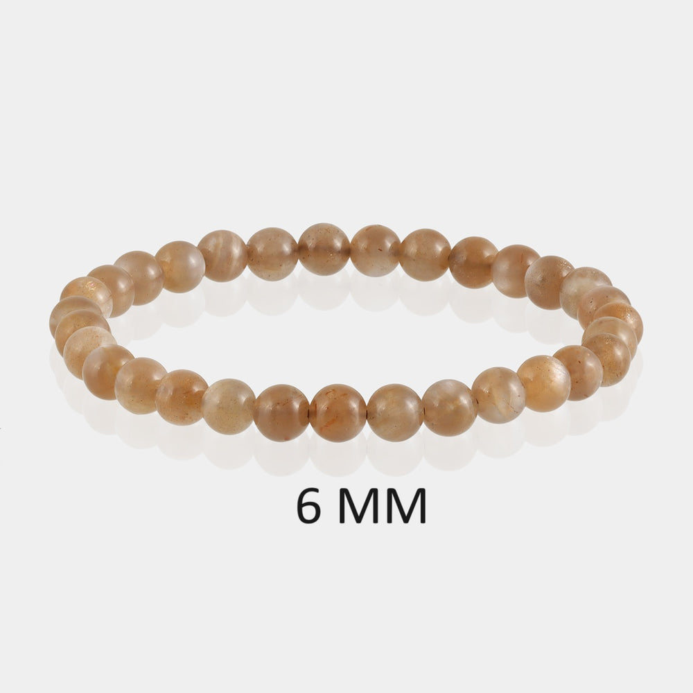 Detailed image showcasing the exquisite 6mm smooth round beads of Chocolate Moonstone, highlighting their rich chocolate hues and subtle sheen associated with divine feminine energy.
