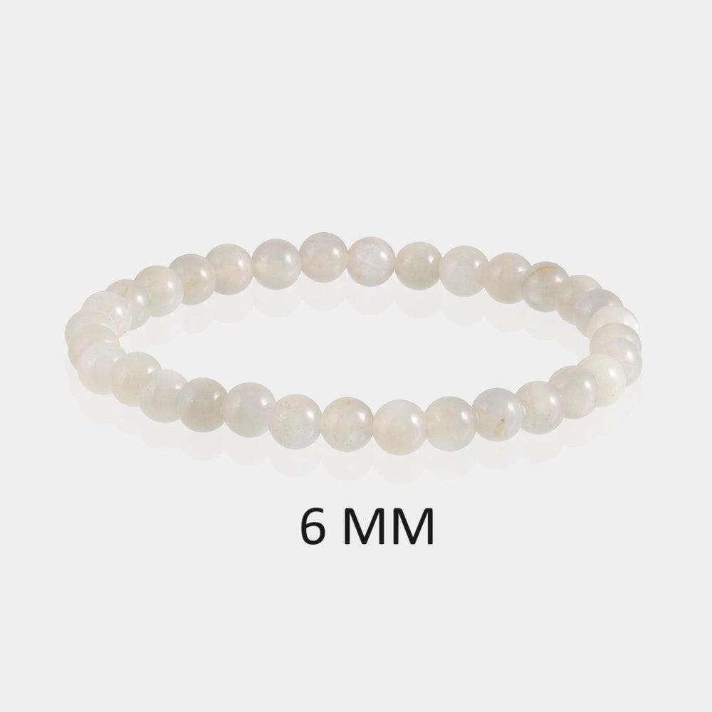 Detailed image showcasing the exquisite 6mm smooth round beads of Gray Moonstone, highlighting their elegant gray hues and subtle sheen associated with intuitive balance