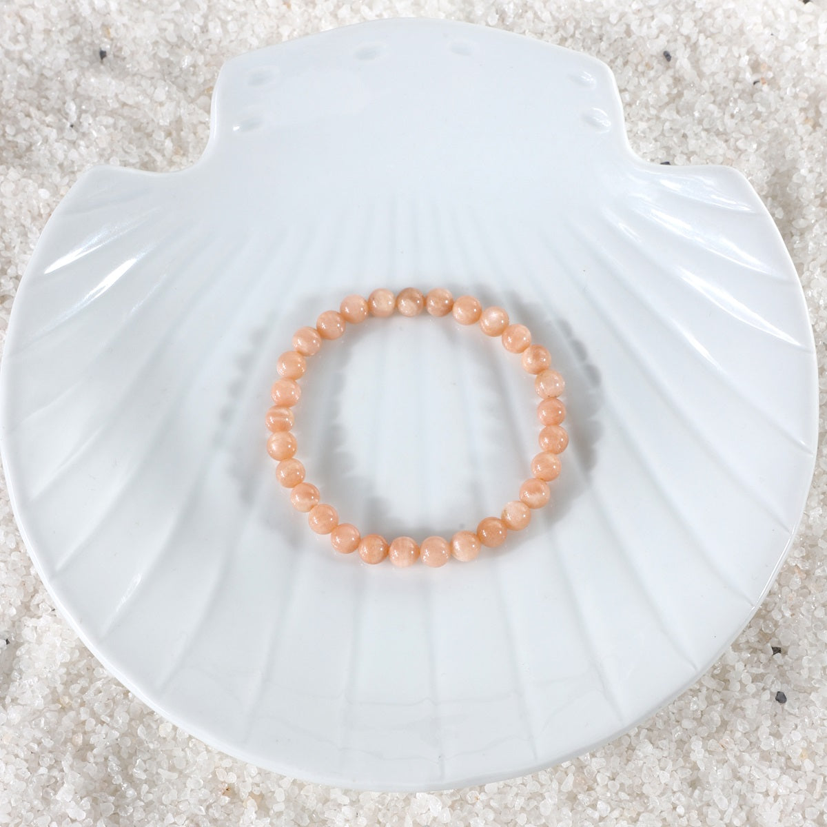 A captivating shot of the Peach Moonstone Bracelet in natural light, emphasizing its beauty and promoting a sense of emotional balance and heightened sensitivity