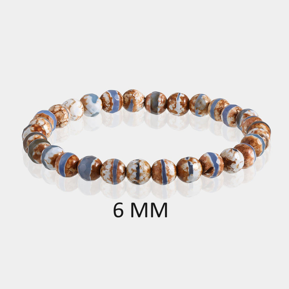 Detailed image showcasing the exquisite 6mm faceted round beads of Tibetan Agate, highlighting their earthy tones and unique patterns associated with spiritual growth