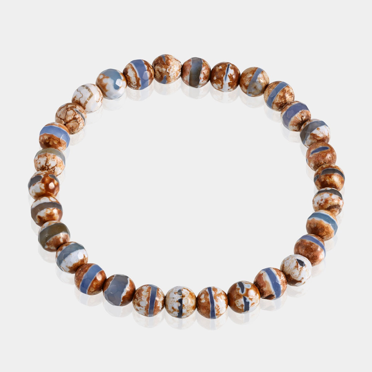 Side view of the Tibetan Agate Stretch Bracelet, showcasing its comfortable fit and the craftsmanship of the 6mm faceted round beads for a sophisticated look