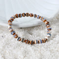 Various styling ideas for the Tibetan Agate Stretch Bracelet, demonstrating its versatility as a chic accessory with spiritual insight and harmonious energies