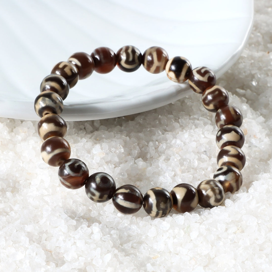 Stylish Brown Tibetan Agate Bracelet featuring 8mm beads, a symbol of good luck and fortune, elegantly adorning the wrist.