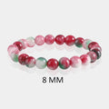 Detailed image showcasing the exquisite 8mm smooth round beads of Watermelon Quartz, highlighting their varied pink and green hues, symbolizing love and positivity