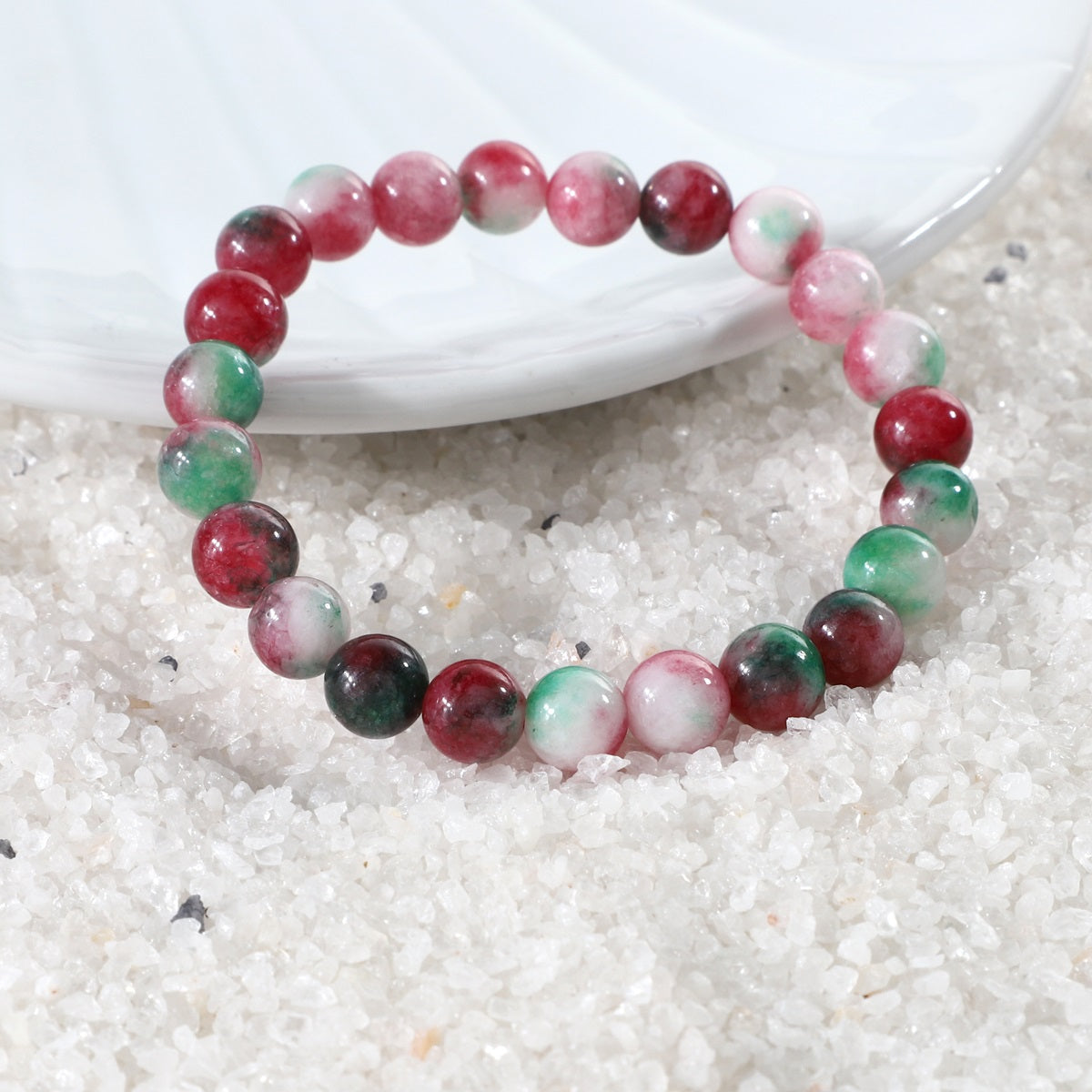 Side view of the Watermelon Quartz Stretch Bracelet, showcasing its comfortable fit and the craftsmanship of the 8mm smooth round beads for a sophisticated appearance