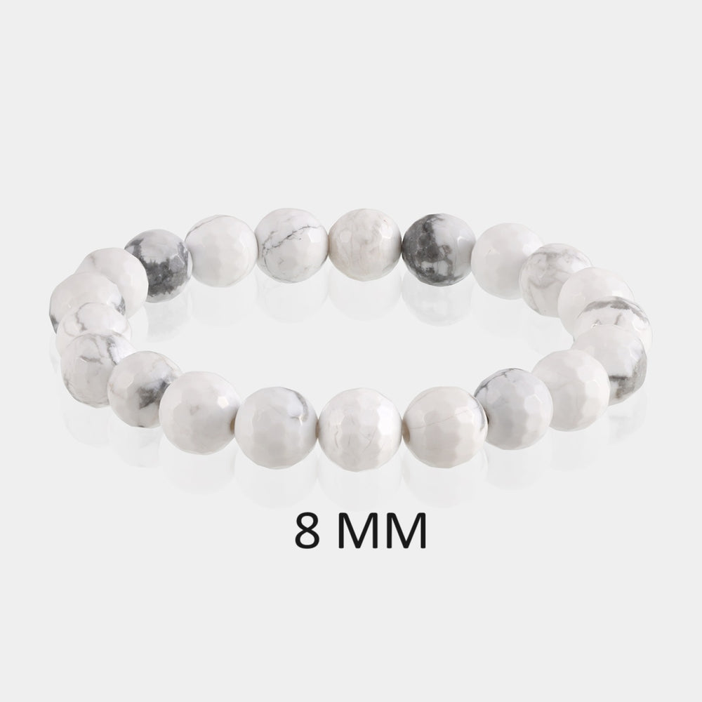Detailed image showcasing the exquisite 8mm faceted round beads of Howlite, highlighting their unique patterns and promoting a sense of calmness