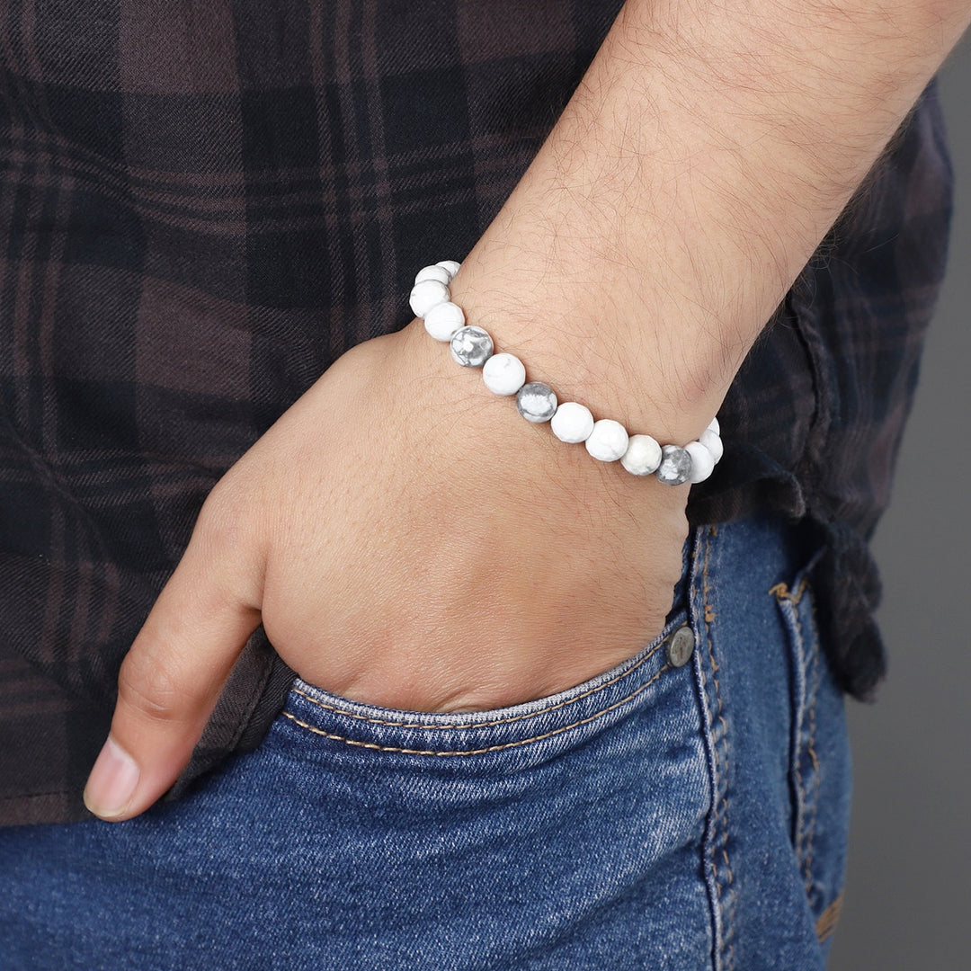 Stylish view of the Howlite Stretch Bracelet with 8mm faceted beads, offering a fashionable and calming accessory for any occasion