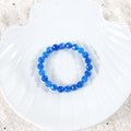 Elegant arrangement of Blue Quartz Bracelet, emphasizing the beauty of the 8mm faceted stones