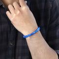 Adorned wrist showcasing the Blue Quartz Bracelet, an accessory that harmonizes style and promotes calm communication