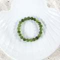 Elegant arrangement of Green Quartz Bracelet, emphasizing the beauty of the 8mm faceted stones