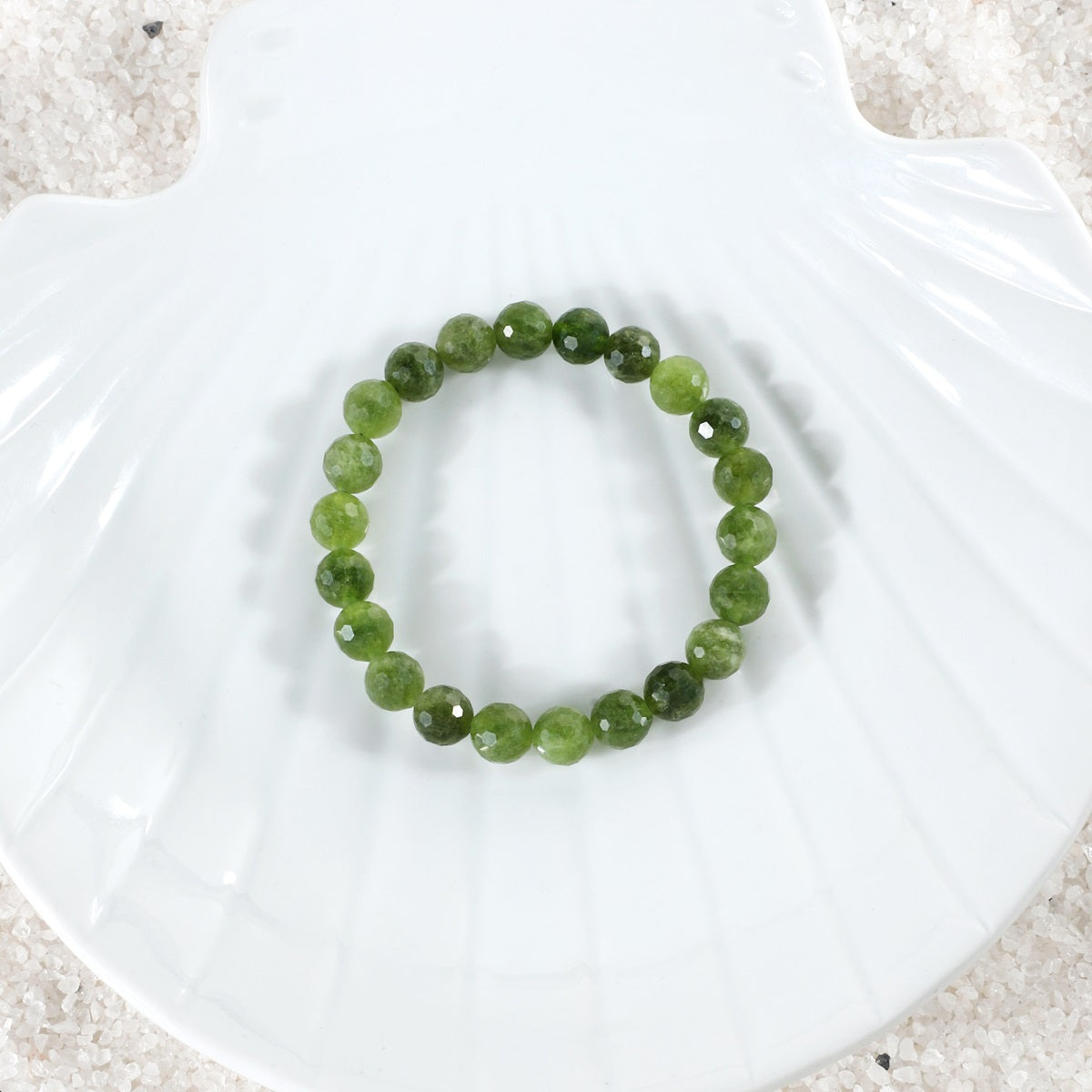 Elegant arrangement of Green Quartz Bracelet, emphasizing the beauty of the 8mm faceted stones