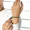 Close-up of Green Quartz stones, symbolizing positive transformation and personal growth for the wearer.