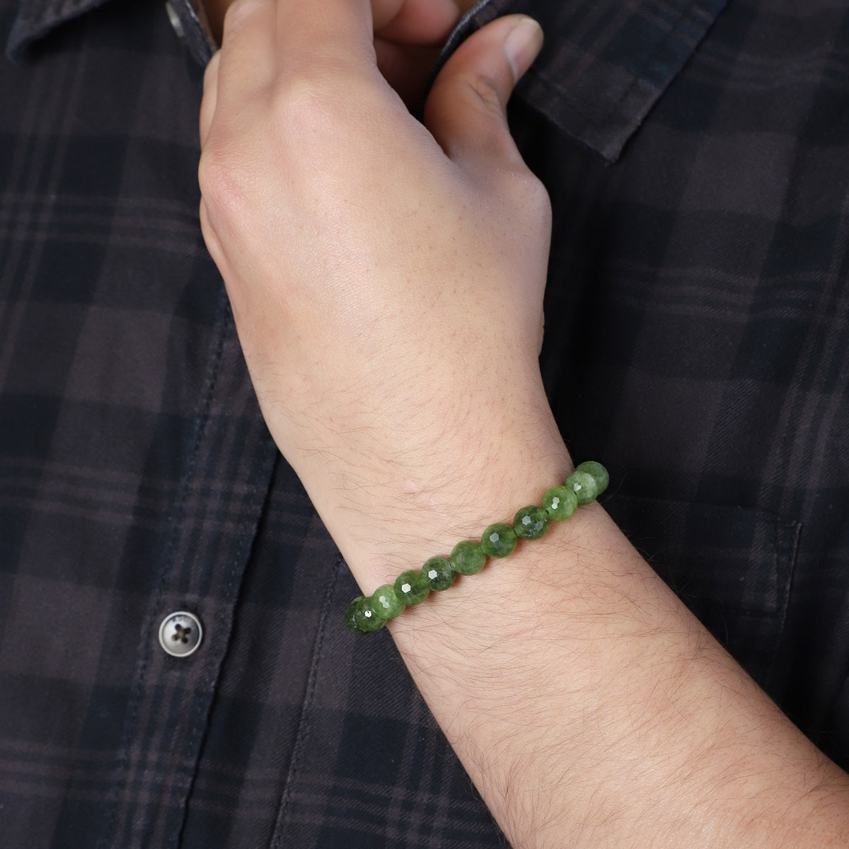 Adorned wrist showcasing the Green Quartz Bracelet, a stylish accessory that enhances vibrancy and positive energy