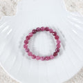 Elegant arrangement of Pink Quartz Bracelet, showcasing the beauty of the 8mm faceted stones