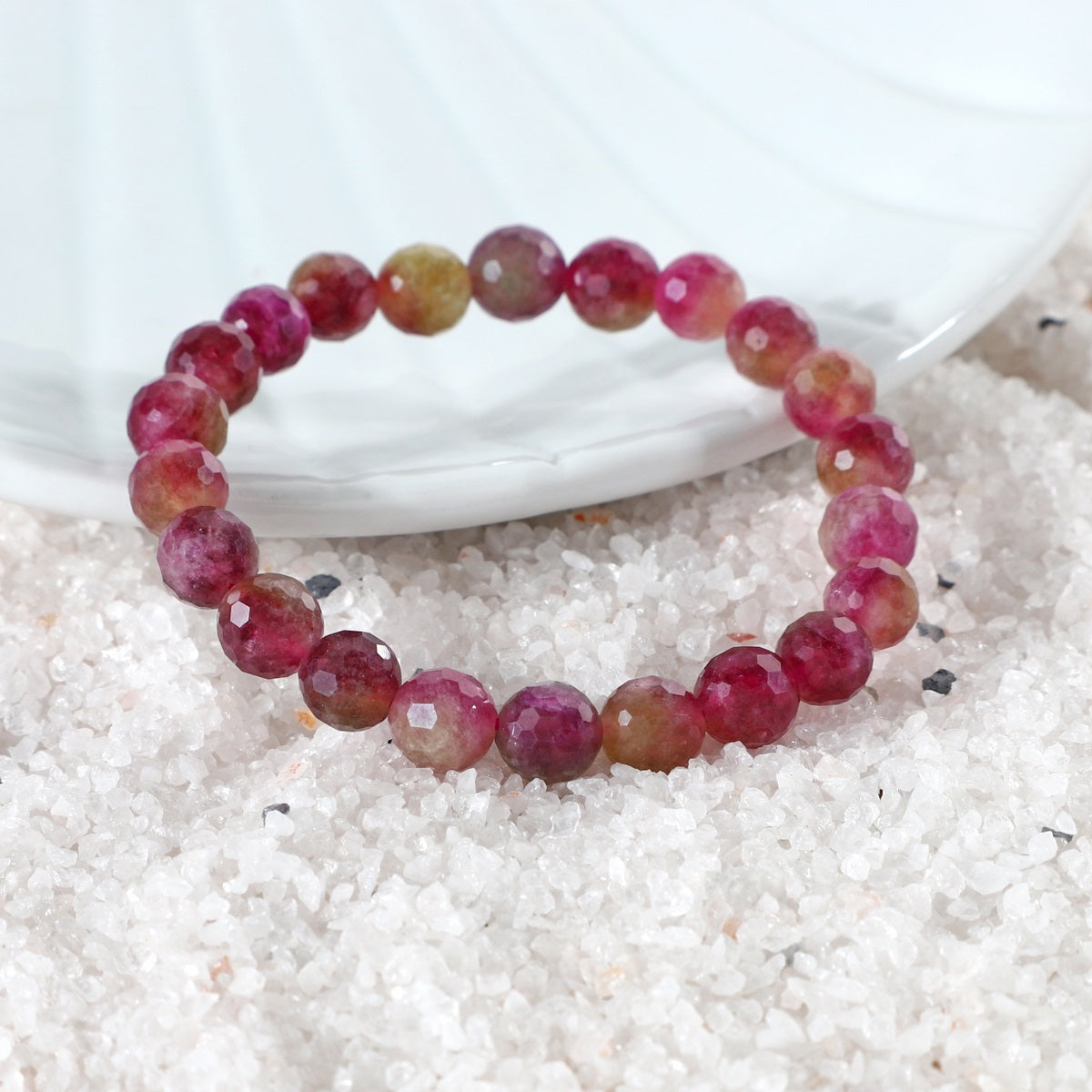 Faceted round Red Quartz stones in the bracelet, reflecting light and adding a touch of sophistication to your look