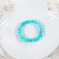 Elegant arrangement of Sky Blue Quartz Bracelet, showcasing the beauty of the 8mm faceted stones