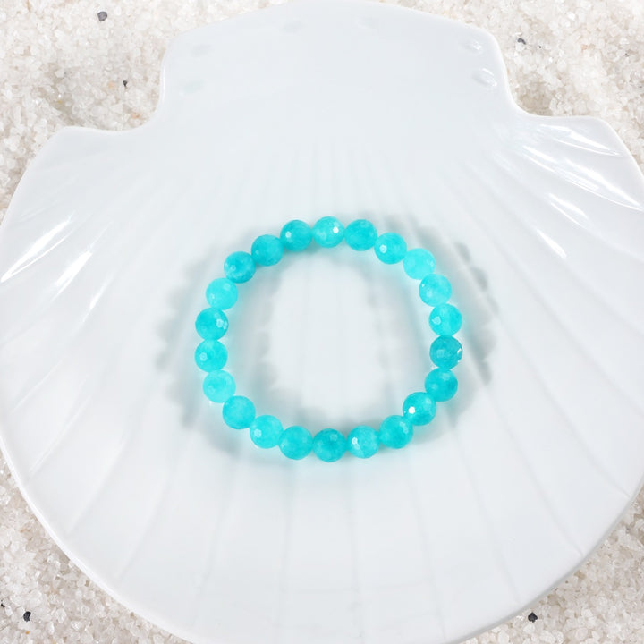 Elegant arrangement of Sky Blue Quartz Bracelet, showcasing the beauty of the 8mm faceted stones