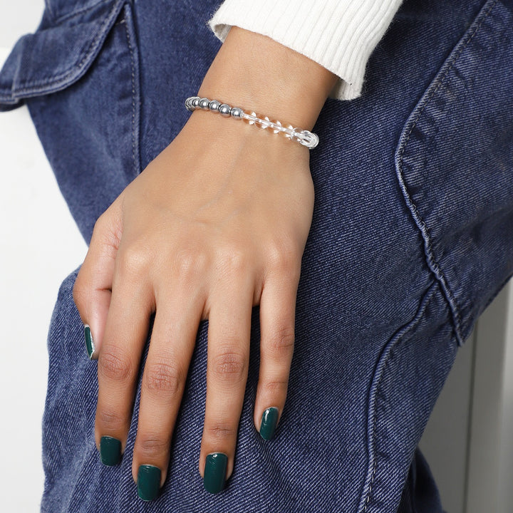 Adorned wrist showcasing the Focus and Concentration Bracelet, featuring 6mm Clear Quartz, Fluorite, and Hematite beads