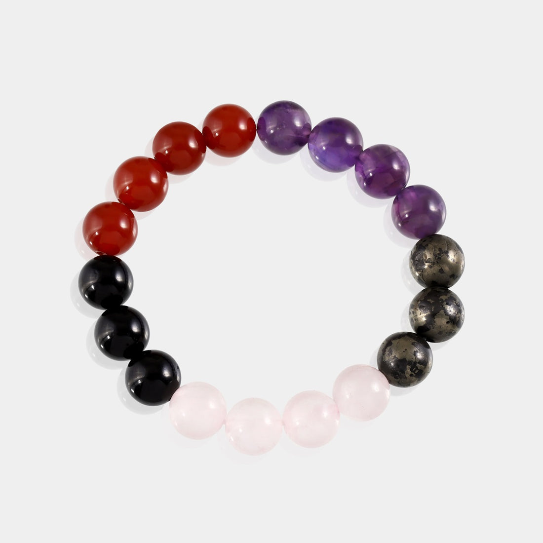 Stylish and meaningful stretch bracelet featuring Black Tourmaline, Amethyst, Rose Quartz, Carnelian, and Pyrite for protection, love, and abundance