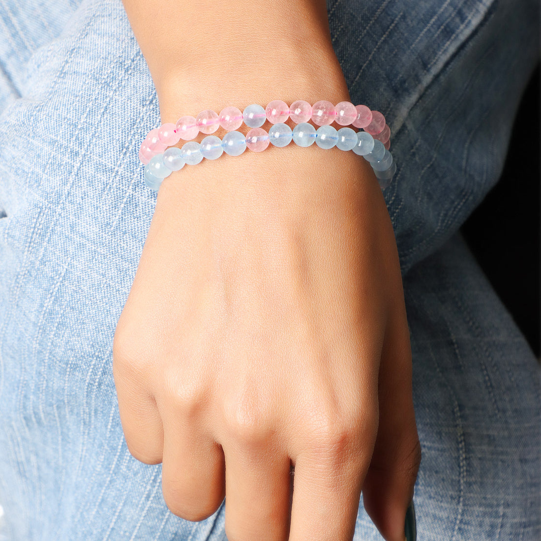 Set of Aquamarine and Rose Quartz gemstone bracelets, beautifully arranged to reflect a perfect balance of colors and positive energy.
