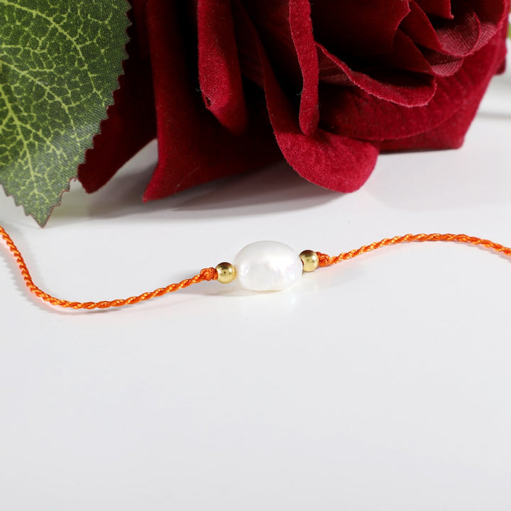 Pearl Rakhi - Elegance & Purity