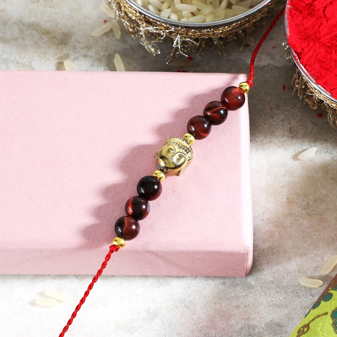 Red Tiger's Eye Hematite Buddha Rakhi - Courage & Grounding