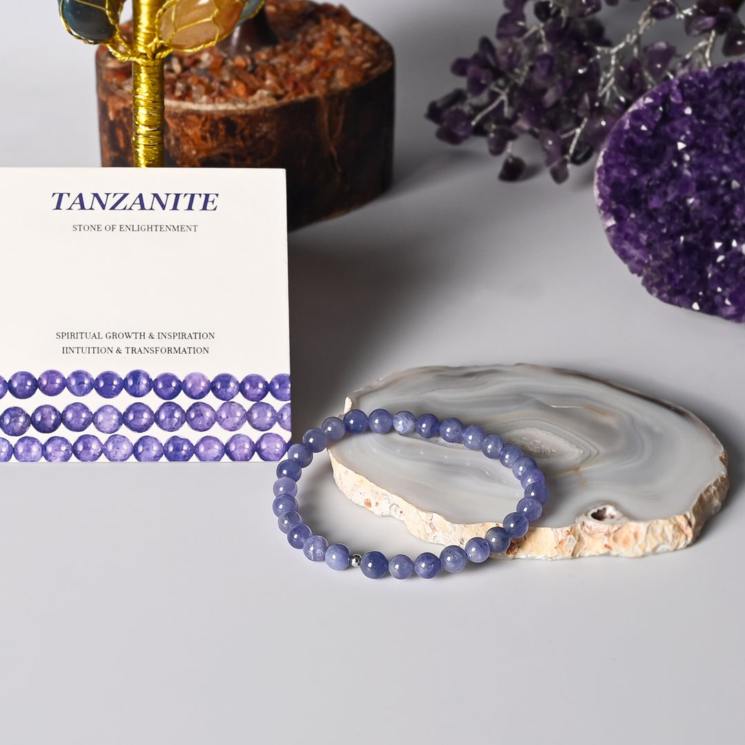 Elegant Tanzanite Stretch Bracelet adorning a wrist, showcasing the Stone of Enlightenment in 6mm smooth round beads