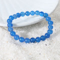 Natural Blue Onyx Bracelet showcasing the beauty and elegance of the gemstone, empowering the wearer.