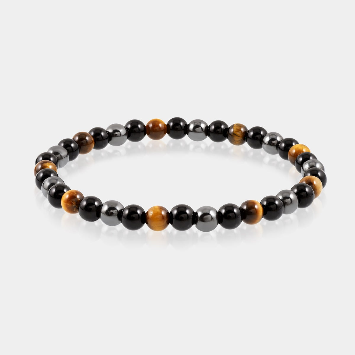 Detailed view of a 6mm and 8mm smooth round Golden Tiger's Eye bead, symbolizing confidence and courage in the Triple Protection Bracelet