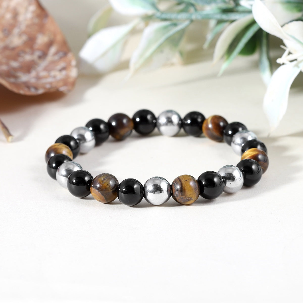 A collection of Triple Protection Stretch Bracelets, each uniquely combining Golden Tiger's Eye, Black Onyx, and Hematite for a trifecta of protective energies