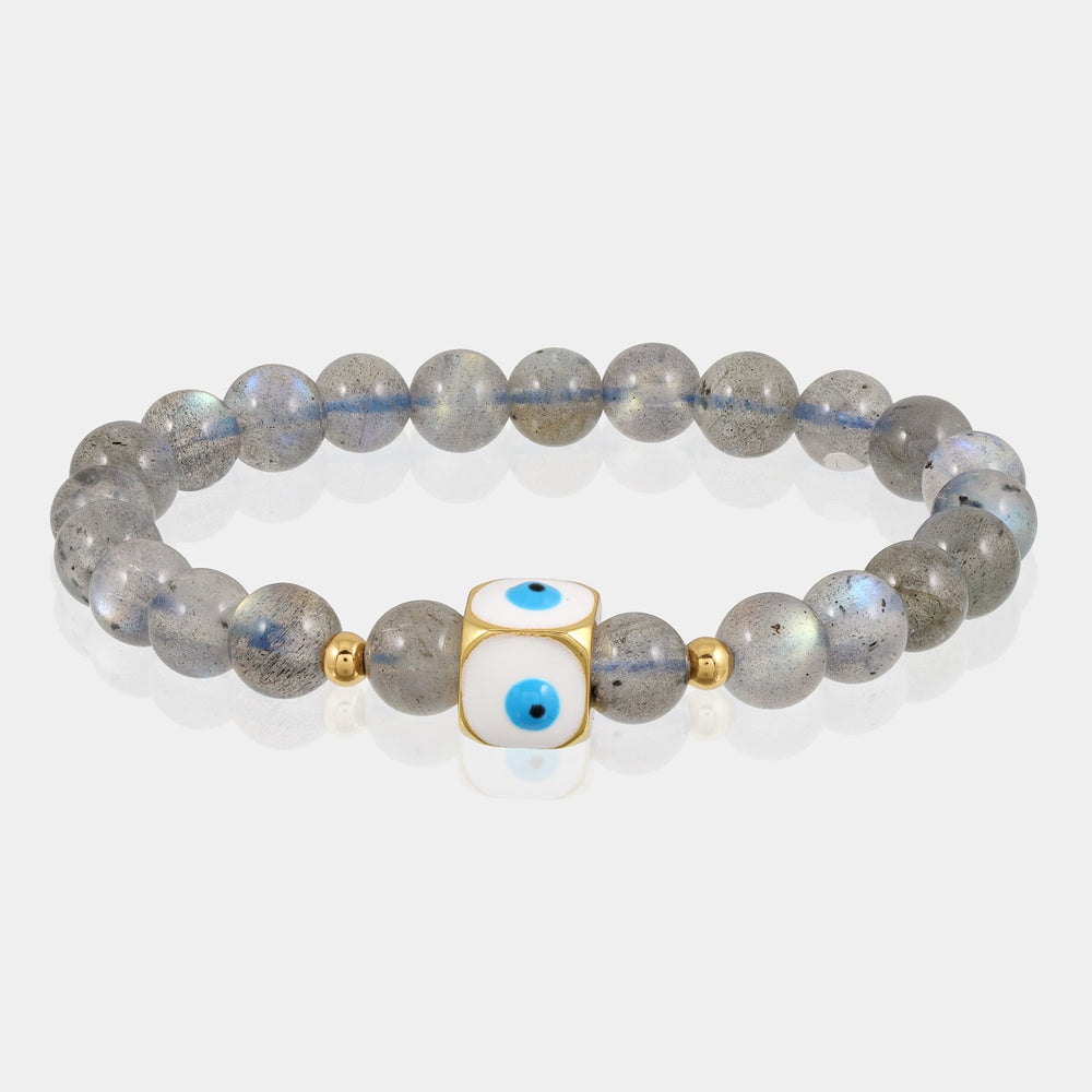 Close-up of smooth round Labradorite gemstone beads in a captivating gray color with iridescent flashes.