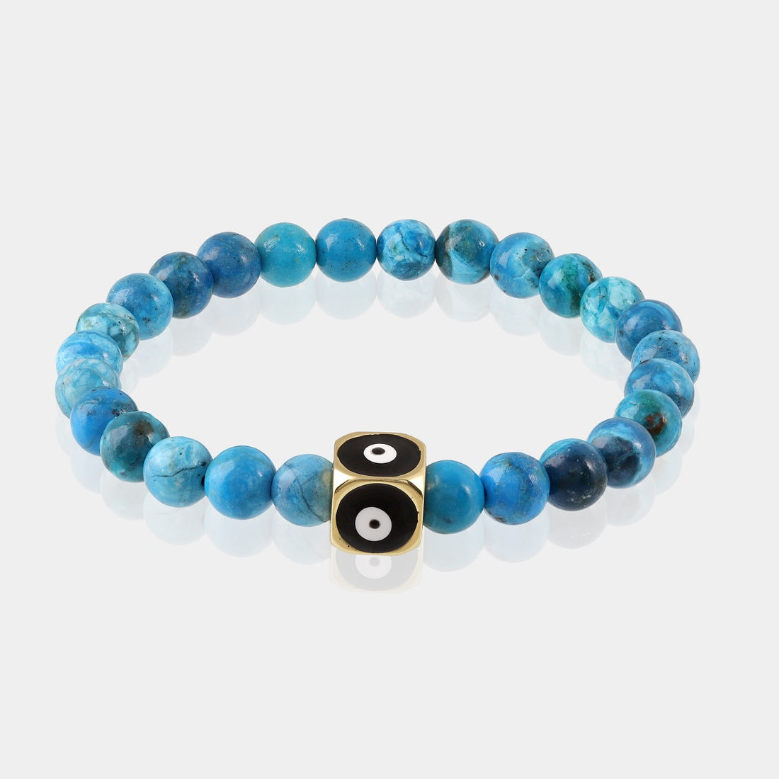 A meticulously crafted stretchable bracelet, featuring Turquoise gemstone beads and an Evil Eye charm, combining elegance and positive energy.