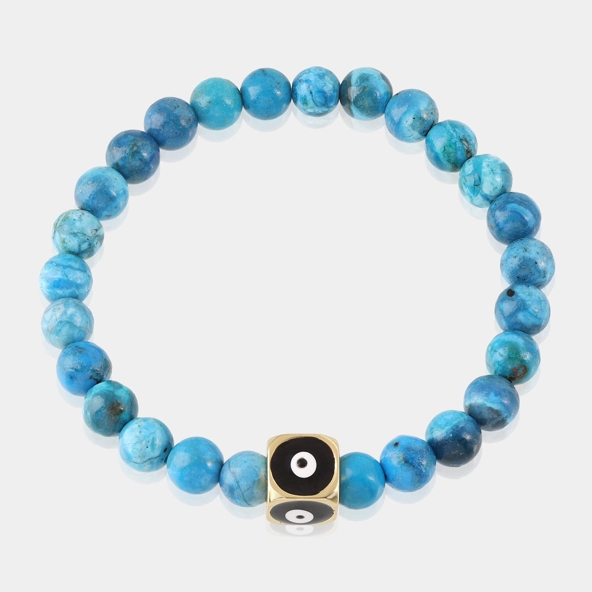 Smooth round beads in a soothing blue shade, radiating tranquility and fostering communication, adorning a stretch bracelet.