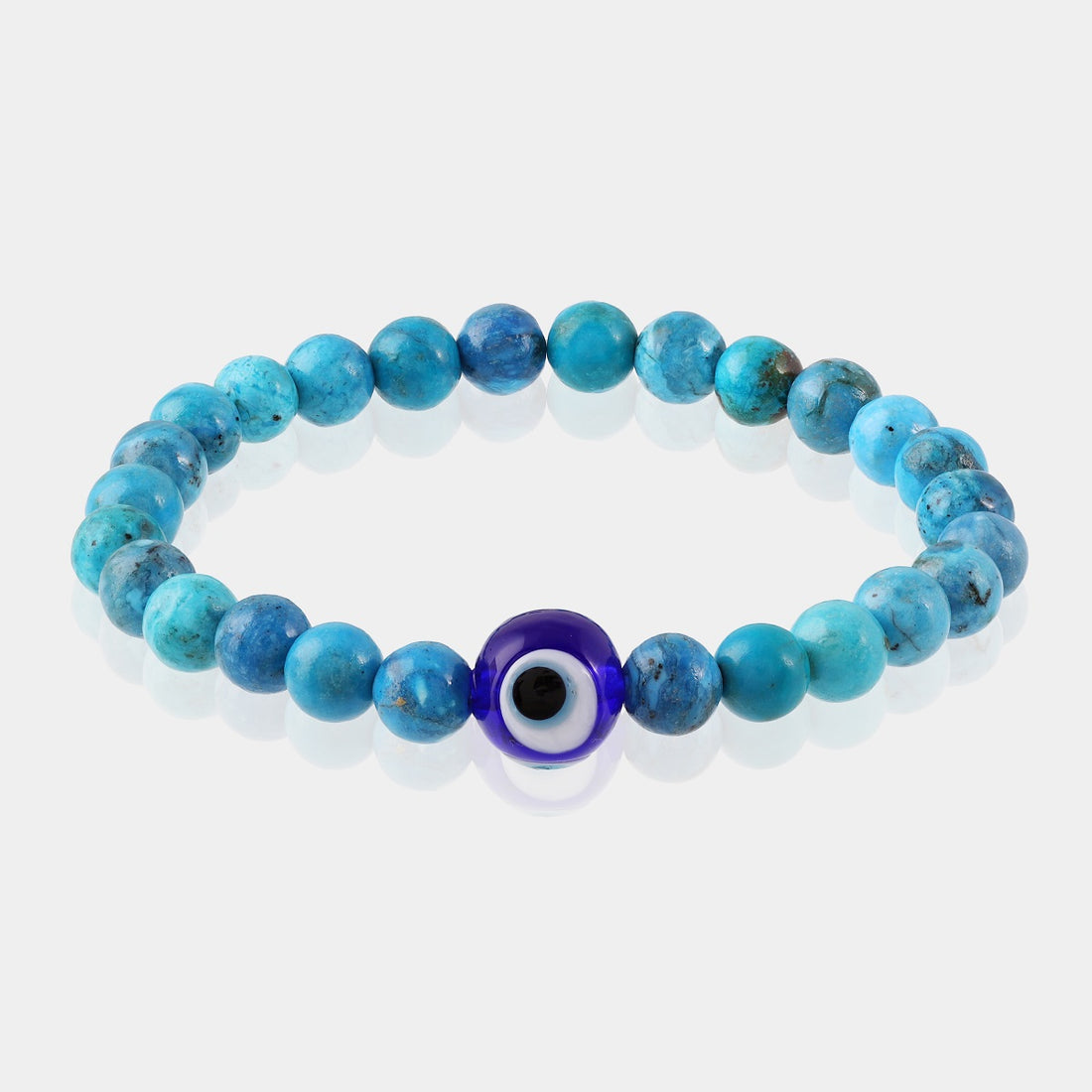  Smooth round beads in a soothing blue shade, radiating tranquility and fostering communication, adorning a stretch bracelet.