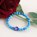 A handcrafted bracelet with Turquoise gemstone beads and an Evil Eye charm, offering a harmonious blend of style and well-being.