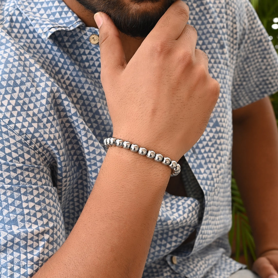 Silver Hematite Stretch Bracelet: Smooth round 8mm beads in serene silver hue