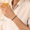 Black Hematite Stretch Bracelet: Smooth round 6mm beads in captivating black hue.