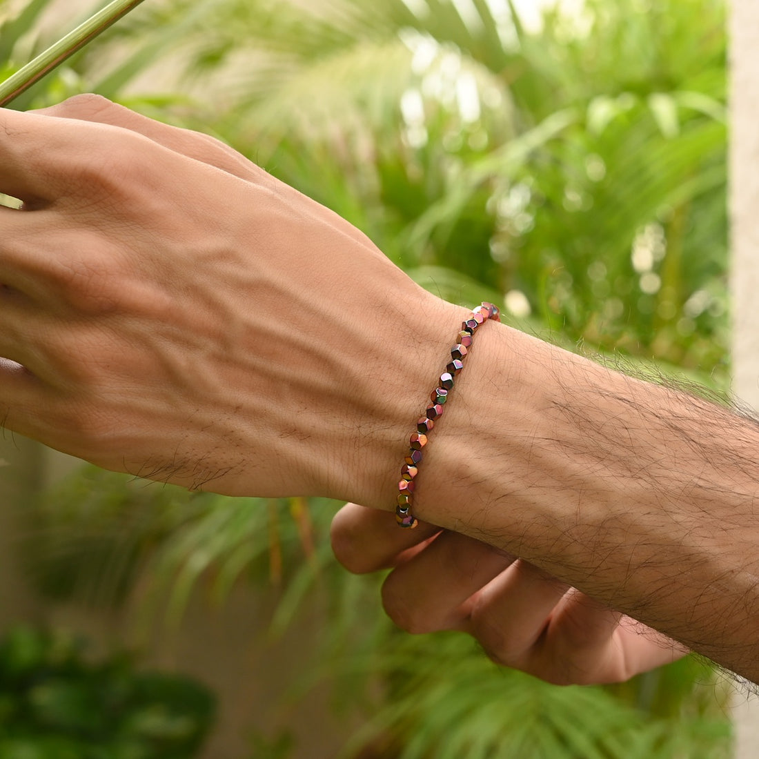 Mystic Pink Hematite Star Cut Stretch Bracelet: Smooth 4mm star cut beads in delicate pink hue