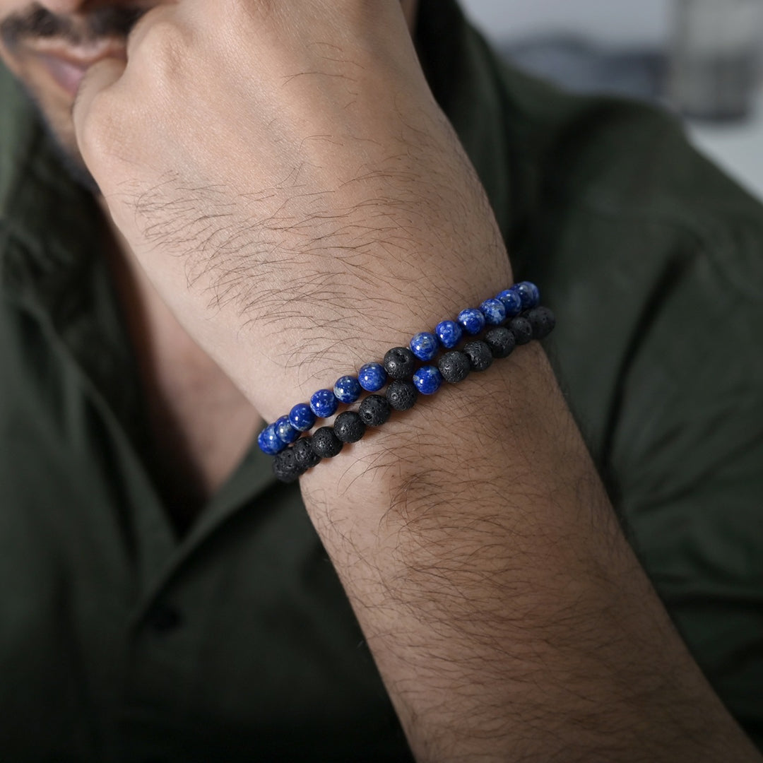 Natural Lapis Lazuli & Lava Gemstone Bracelet. Emphasis on the wrist, highlighting the 6mm beads for a refined and regal look.