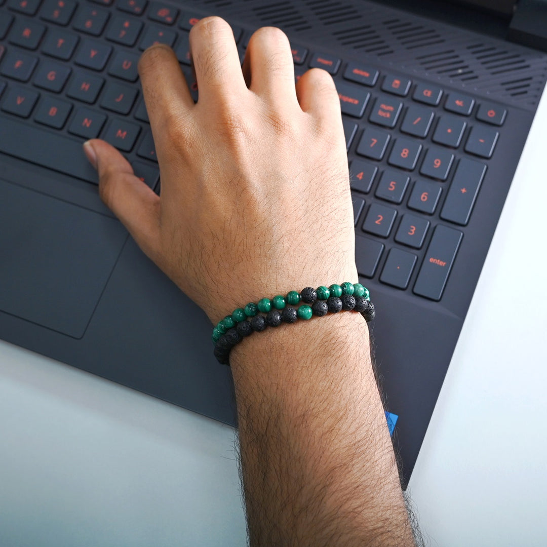 Elegant Malachite and Lava gemstone bracelet gracefully adorning the wrist, blending fashion with the positive energy of natural stones