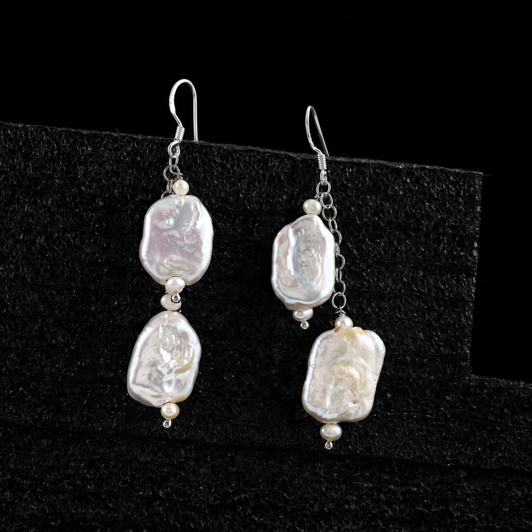 Detailed view of the smooth potato-shaped pearls on 925 Sterling Silver earrings - Classic and Unique.