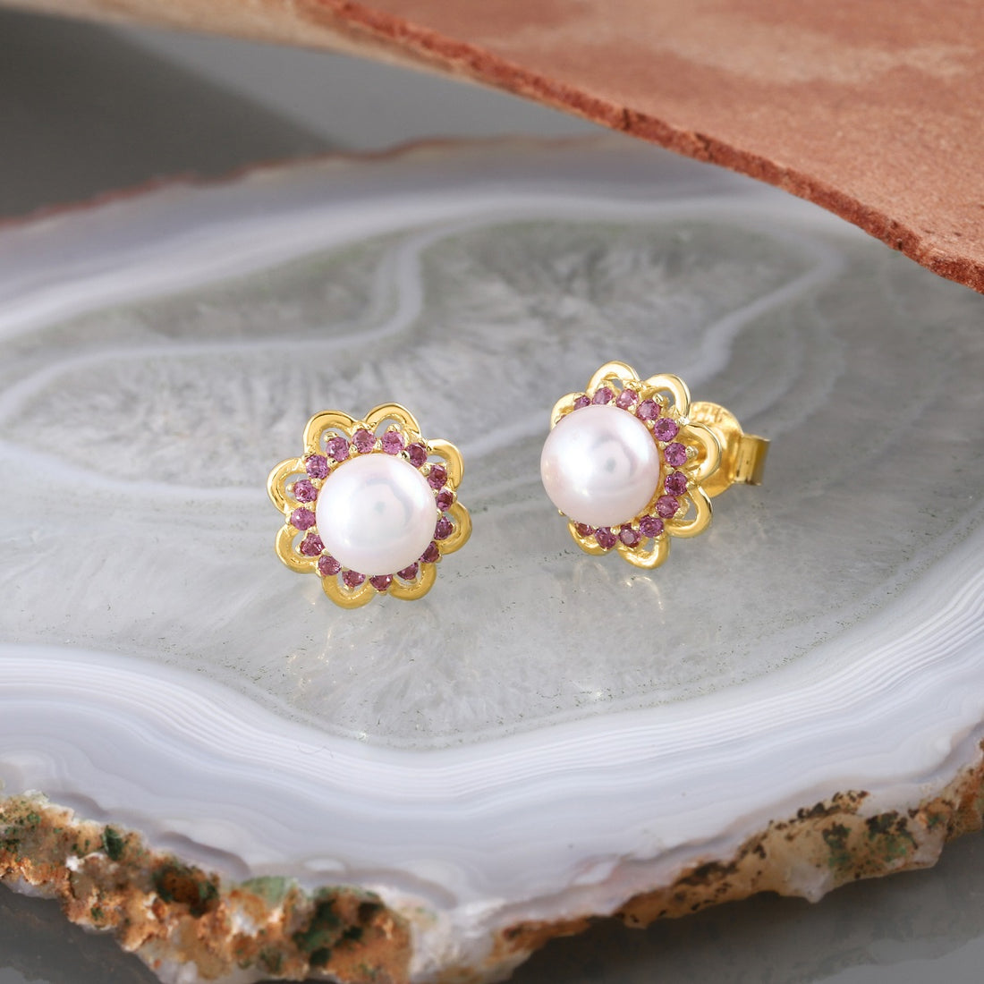 Prong-Set Pearl and Rhodolite Gemstones in Earrings
