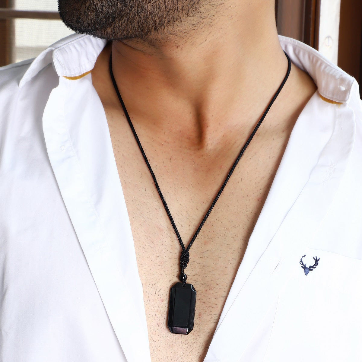  An image showcasing the pendant securely wrapped on the rope necklace, emphasizing its durability and stylish presentation.