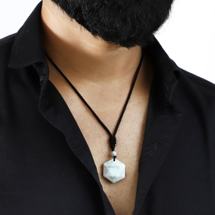 A visual representation of the weight of the pendant necklace, emphasizing its substantial yet comfortable feel on the neckline.